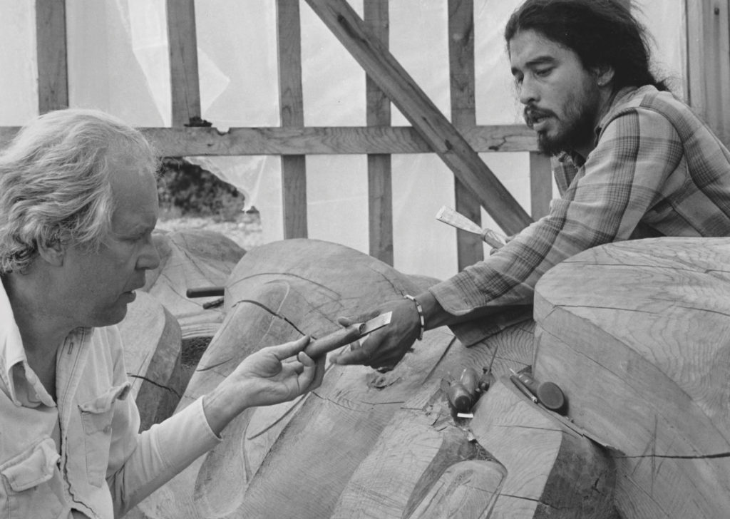 Guujaaw working with Bill Reid on Reid's Dogfish Pole for Skidegate